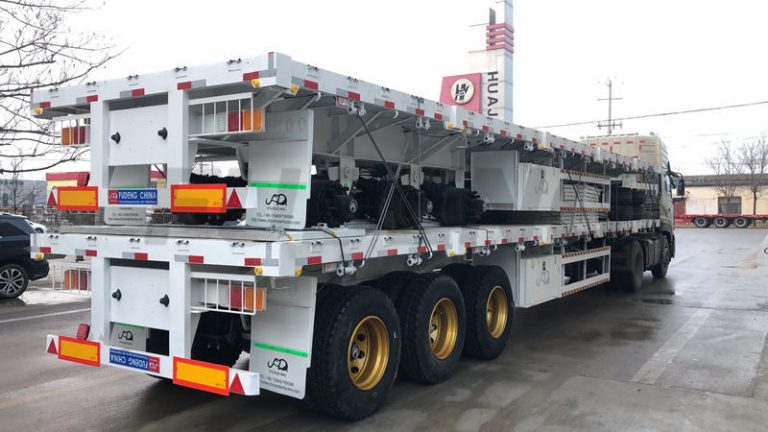 The African custom drop side trailer is on the road