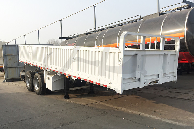 Product Description FUDENG 2 axles 20ft sidewall container semi trailers the sidewall height is 800mm can satisfy mostly customers loose cargo haulage demands. The customer need to do short distance haulage and the road condition very bad, instead of choose 40ft lnegth sidewall semi trailers the customer need shorter trailers to transport. The road has many curve turns which need the trailer easy to make a turn.